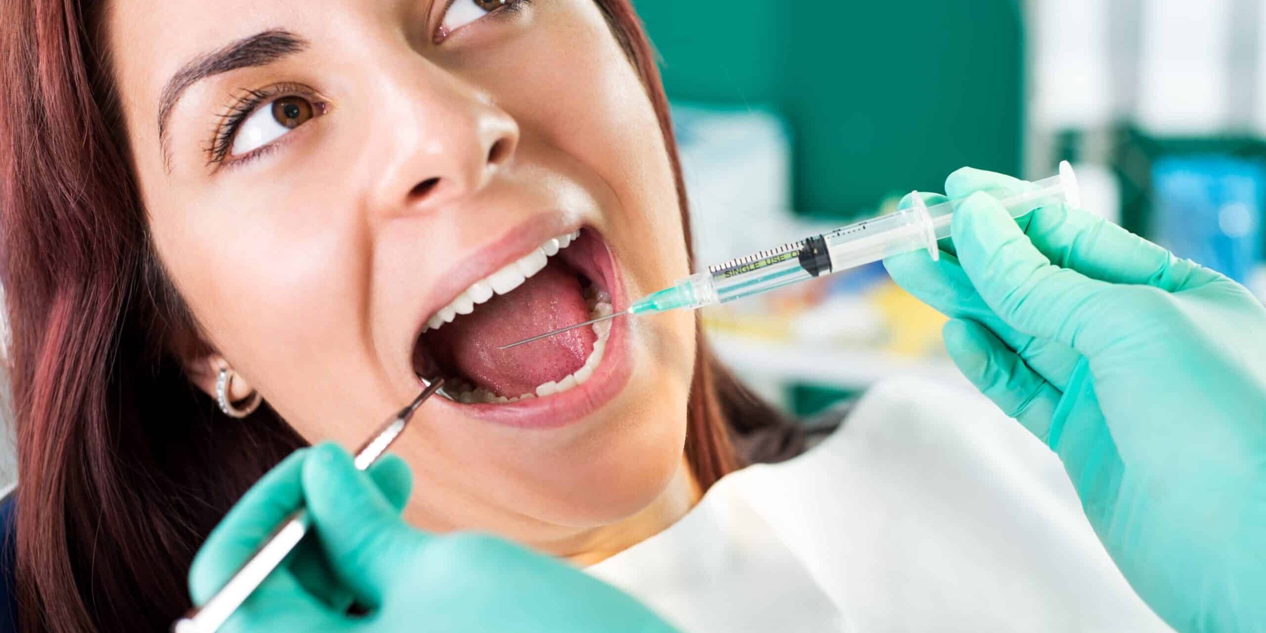 Giving anesthesia to the patient before dental surgery
